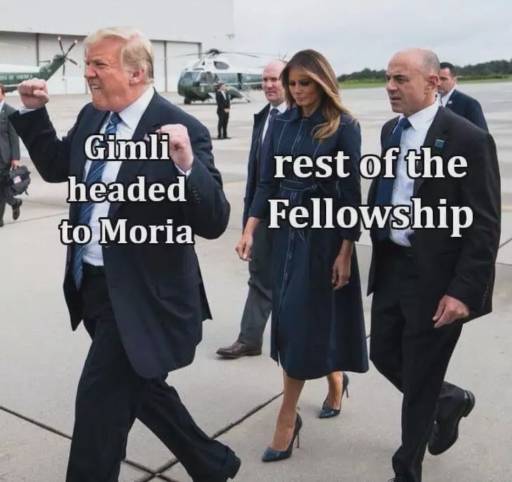 Trump followed by his wife Melania and the secret service.
                                                        Trump is hyped holding his firsts up. He is labeled as "Gimli headed to Moria".
                                                        The people following him are not very pleased, labeled as "rest of the fellowship"