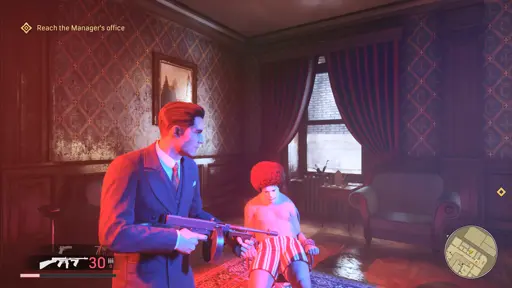 Mafia Definitive Edition screenshot. 
                                            Tommy in front of a half naked clown in a chair.